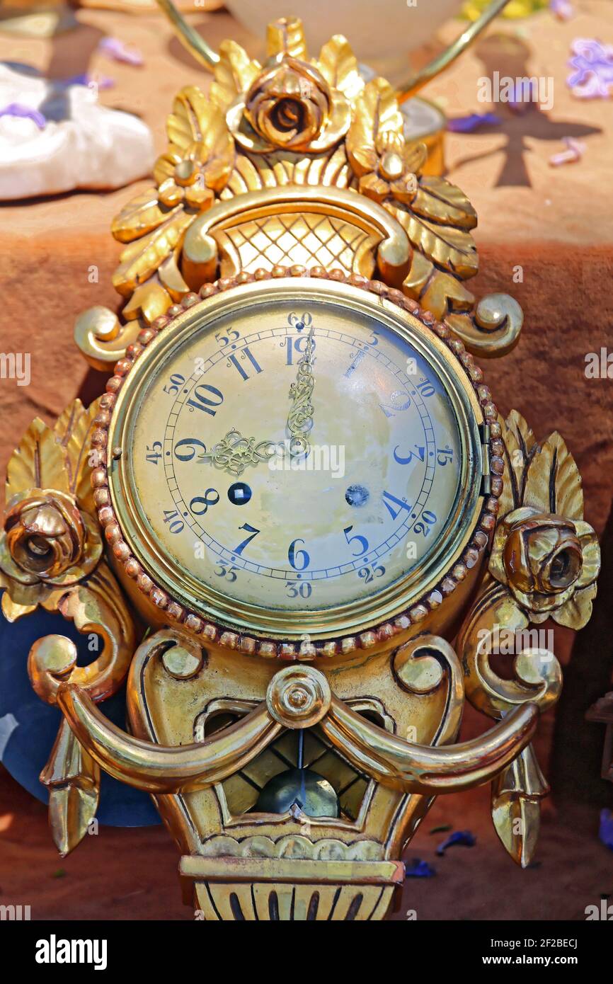 Antique Analog Gold Wall Clock at Flea Market Stock Photo - Alamy
