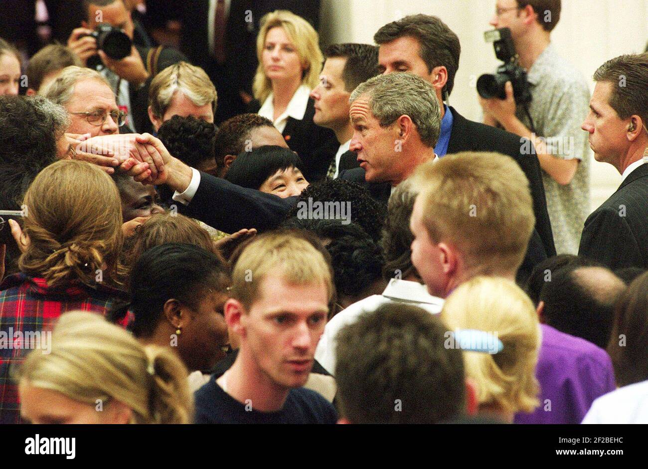 US President Bush shakes hands with members of the public during his visit to the British Museum in London Thursday July 19, 2001. The President is on a visit to the British capital, and was later going on to have lunch with Britain's Queen Elizabeth II and talks with Prime Minister Tony Blair. (AP Photo/Tom Pilston, POOL) Stock Photo
