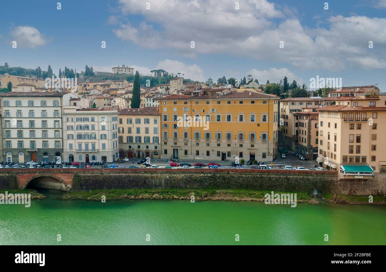 Facades of typical houses and palaces along the Arno river in Florence ...