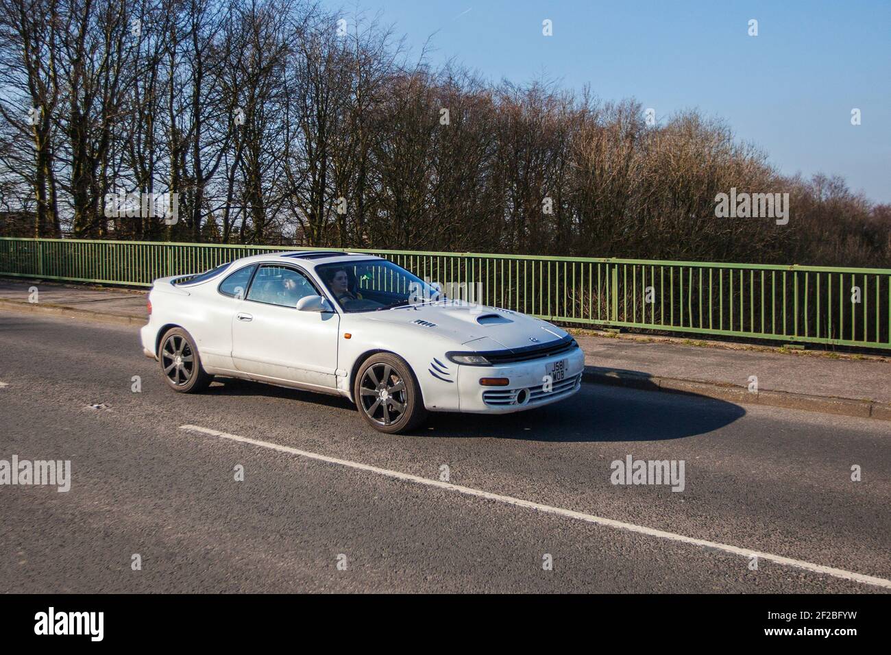 1992 90s white 2000cc Toyota Celica Gt-4; Vehicular traffic, moving vehicles, cars, vehicle driving on UK roads, motors, motoring on the M6 motorway highway road network Stock Photo