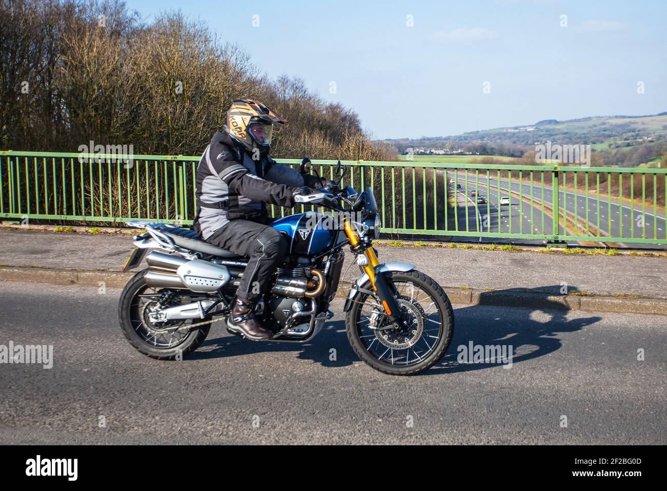 2019 blue Triumph Scrambler 1200 Xe 1200cc; Motorbike rider; two wheeled transport, motorcycles, vehicle, roads, motorbikes, motorcycle bike riders motoring in Chorley, UK Stock Photo
