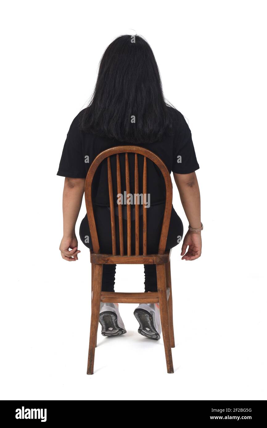 rear view of a latin woman sitting on white background Stock Photo Alamy