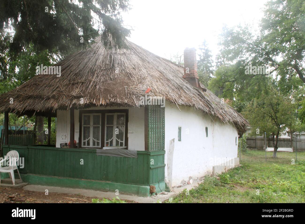 Simple traditional mud house with thatched roof in Snagov, Romania Stock Photo