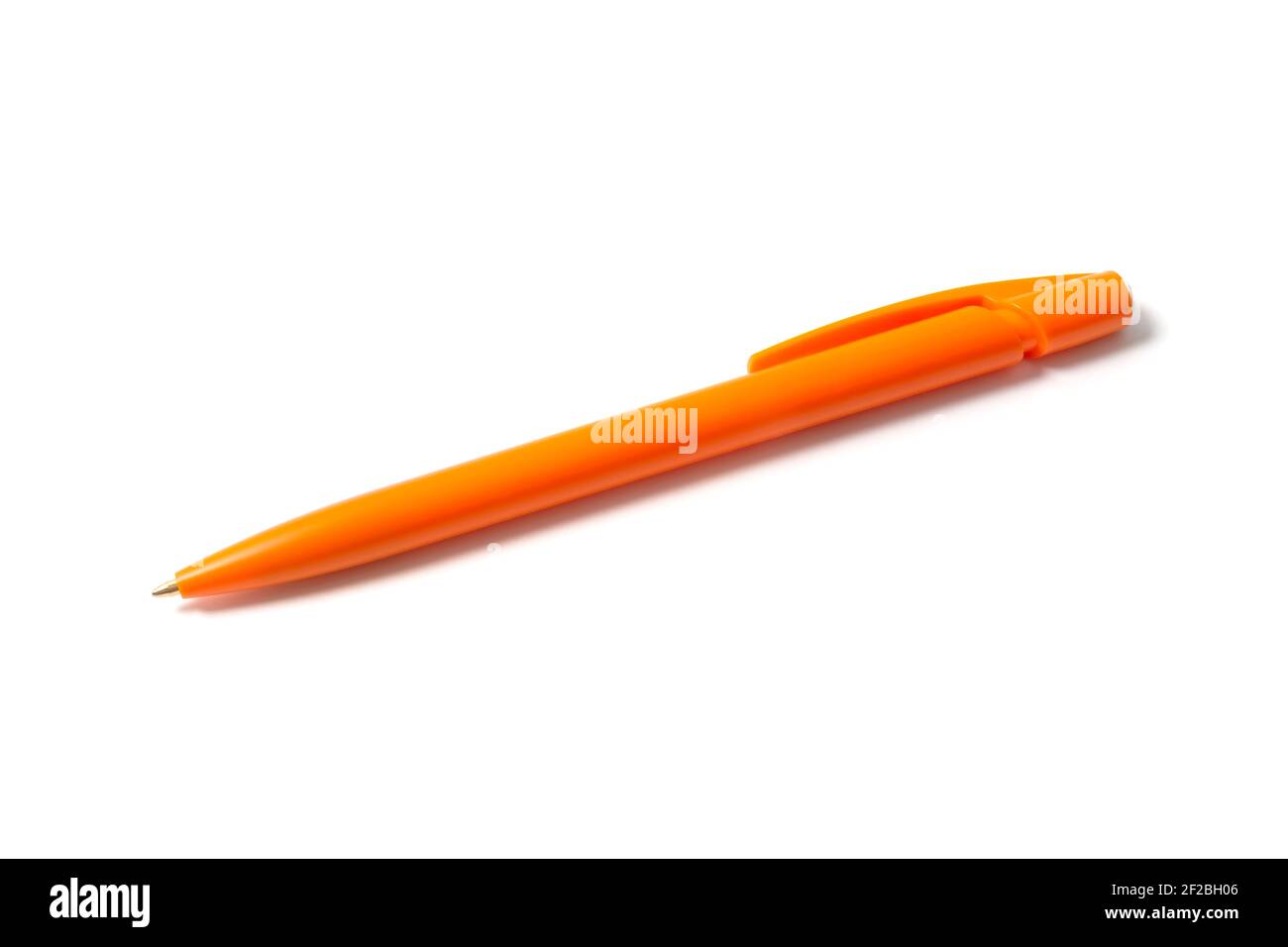 Orange ballpoint pen on white Stock Photo