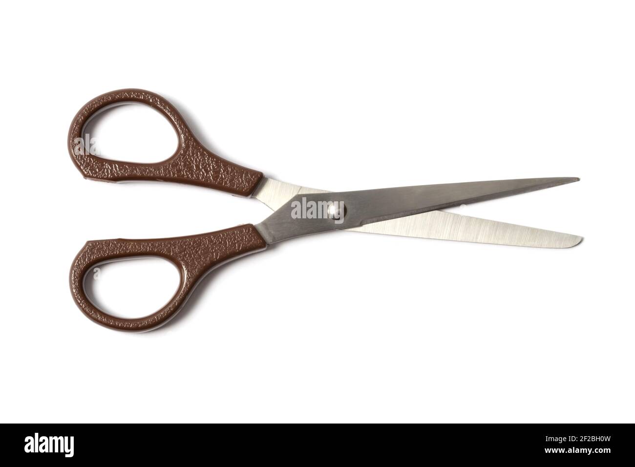Brown scissors on white Stock Photo