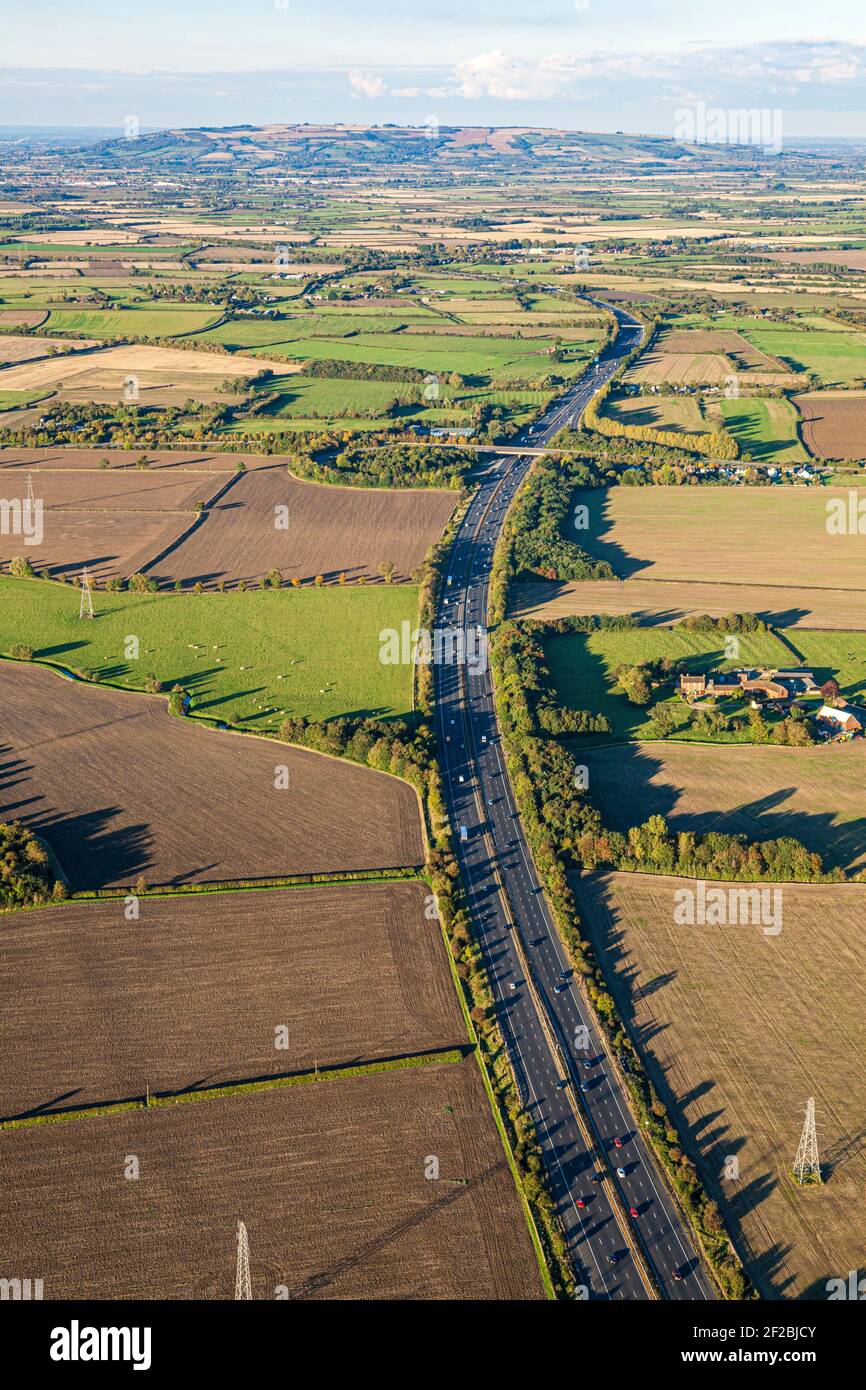 An aerial view of the M5 motorway at Staverton, Gloucestershire, UK - looking north towards Bredon Hill Stock Photo