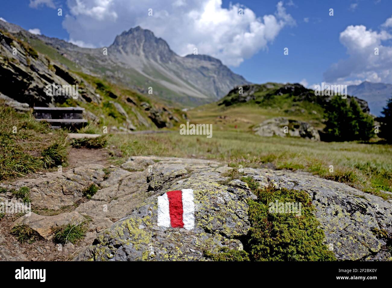 Alpine pathway with Swiss Alps's scenery in the Engadin Valley. Sils Maria, Maloja, Switzerland. Stock Photo