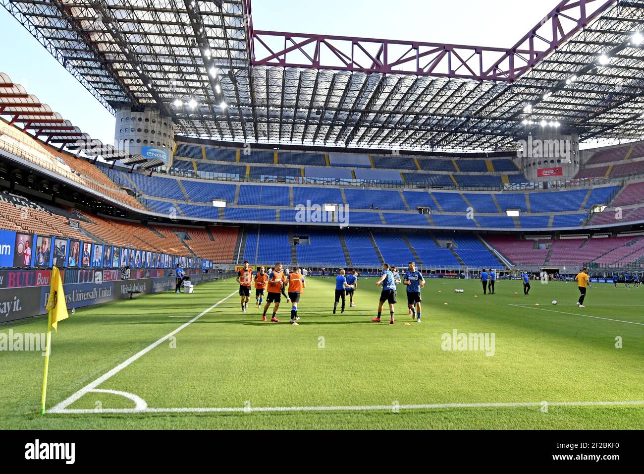 Inter Milan's football players warm-up in an empty Giuseppe Meazza's stadium, due to the Covid-19 healthy rules, in Milan.Italy. Stock Photo
