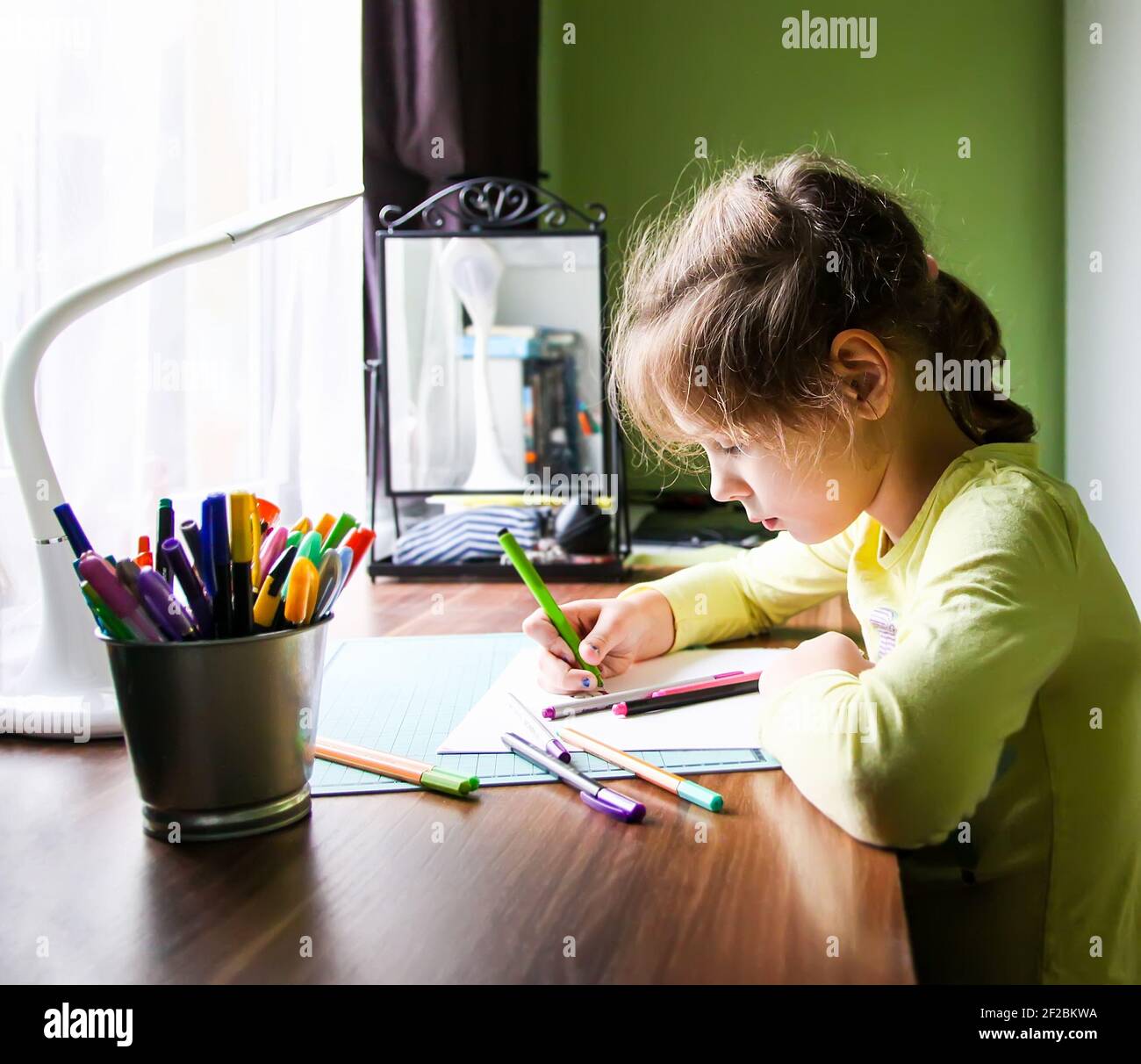 Happy teen schoolgirl doing homework hi-res stock photography and ...