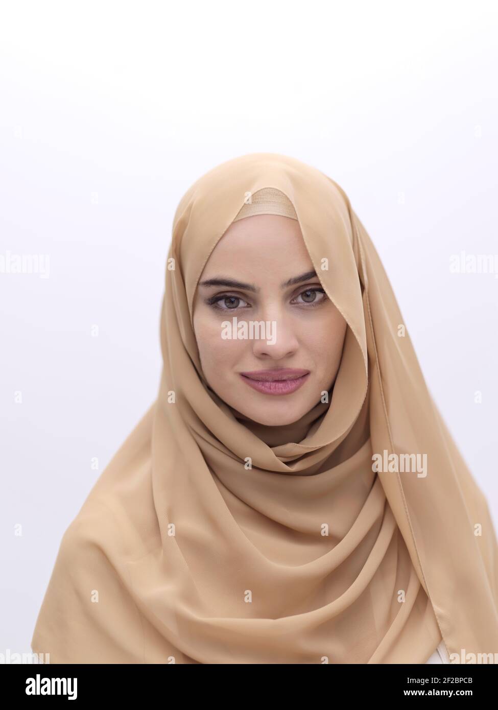 Portrait of young muslim woman wearing hijab isolated on white ...