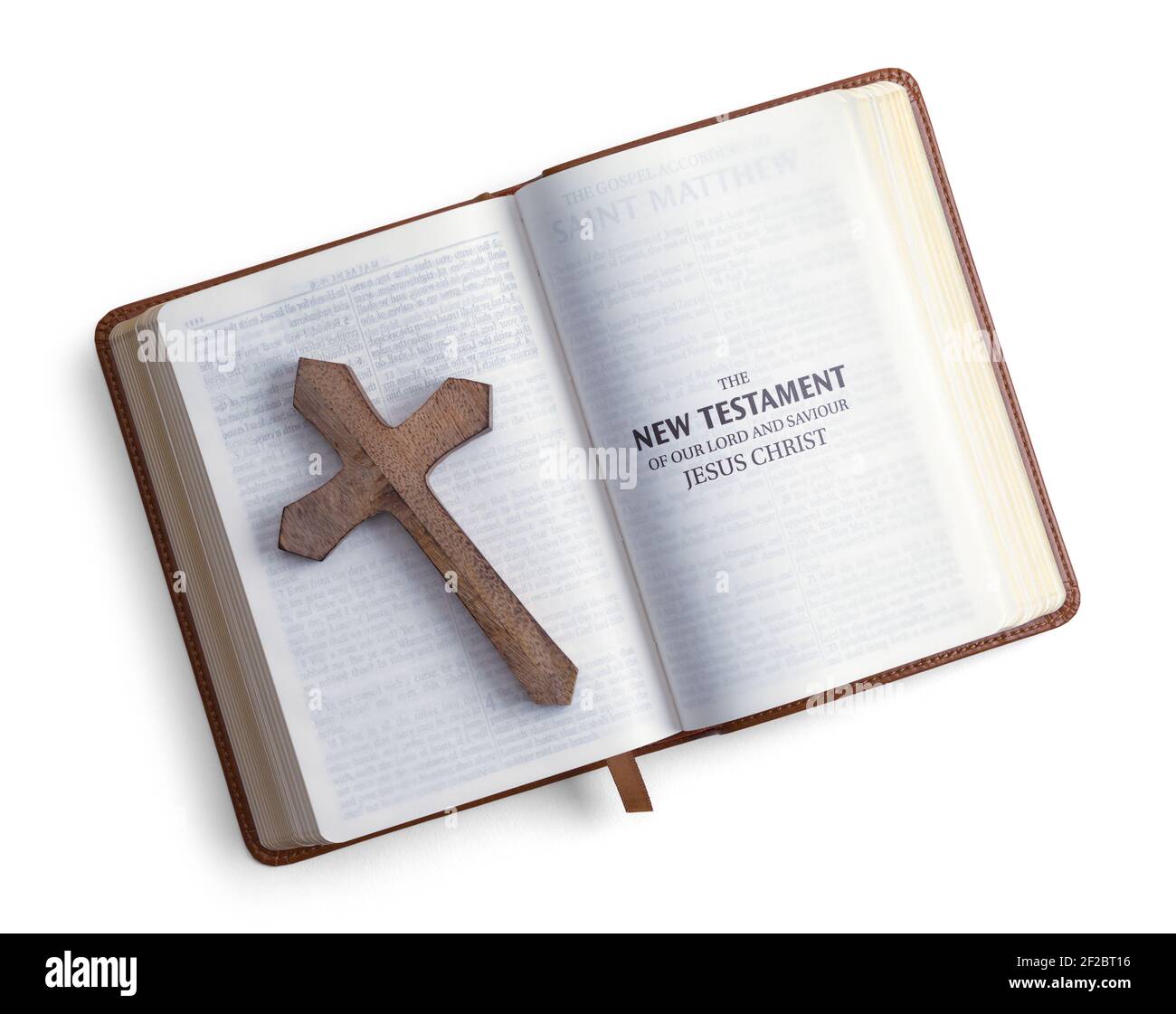 Bible Opend to New Testament with Wood Cross Cut Out. Stock Photo