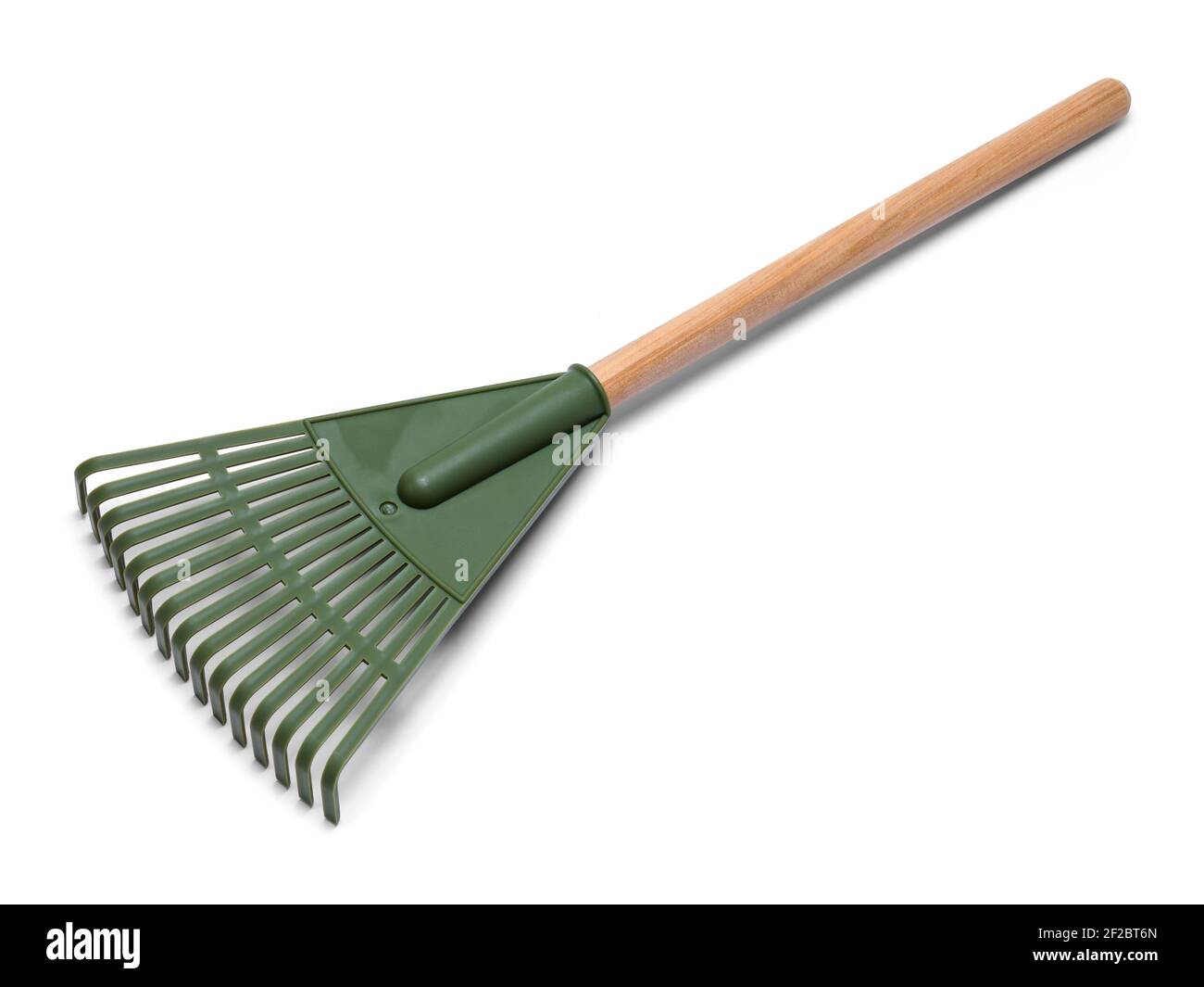 Green Plastic Rake with Wood Handle Cut Out. Stock Photo