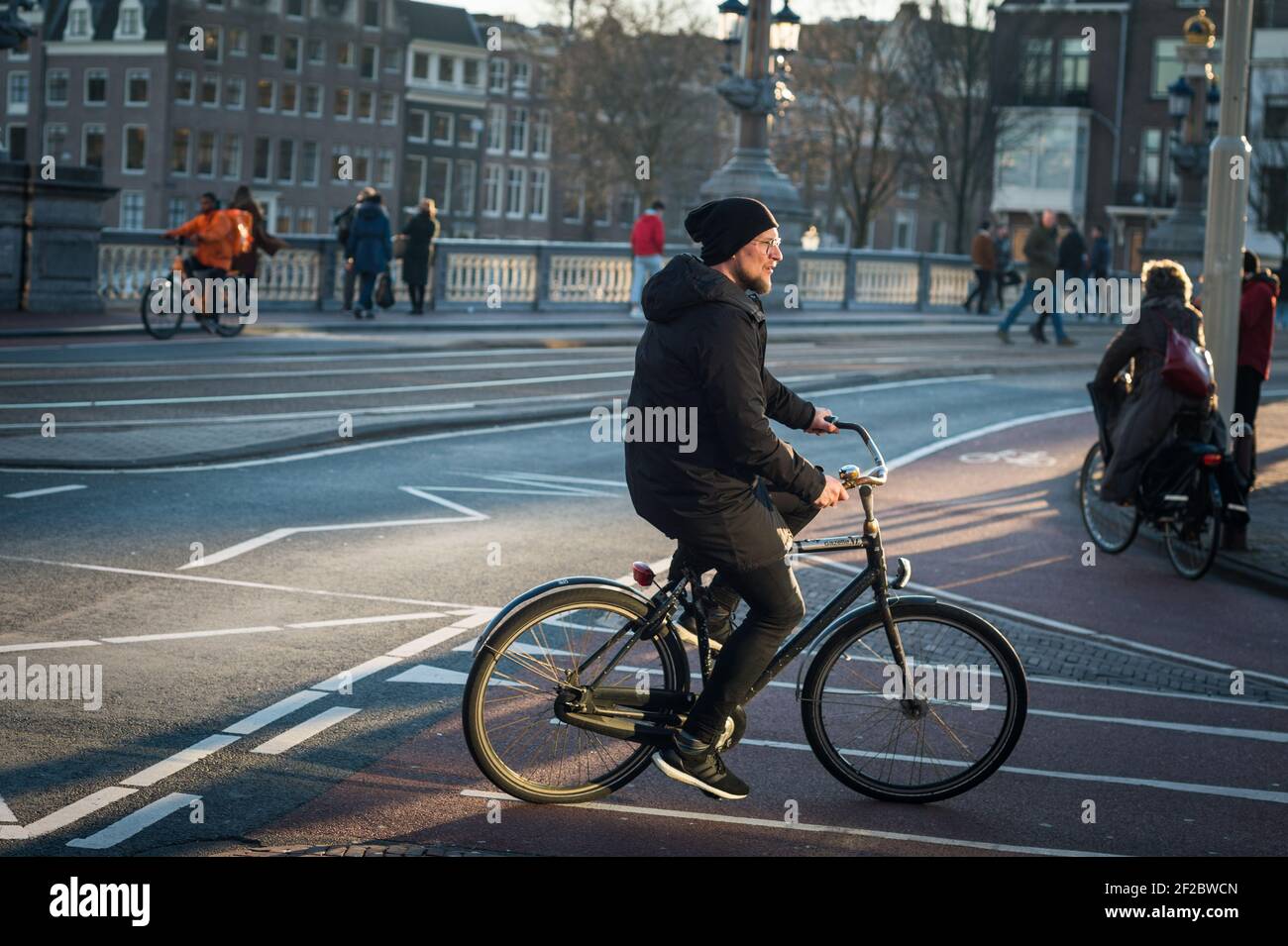 A cyclist on Blauwbrug, Amsterdam, Netherlands. Stock Photo