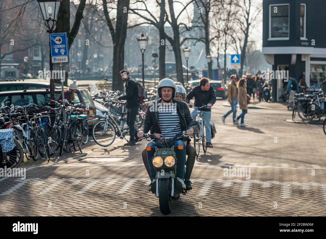 Cyclists on Prinsengracht, Amsterdam, Netherlands. Stock Photo