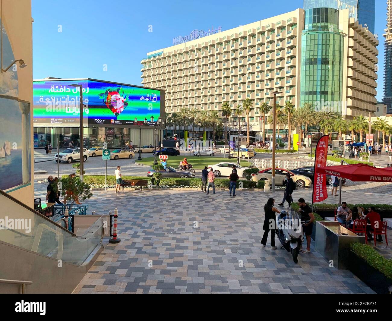Dubai - UAE - December 18, 2020: View of JBR beach touristic street. Jumeirah Beach Residence main street with a crossroad, round about, and a lot of Stock Photo