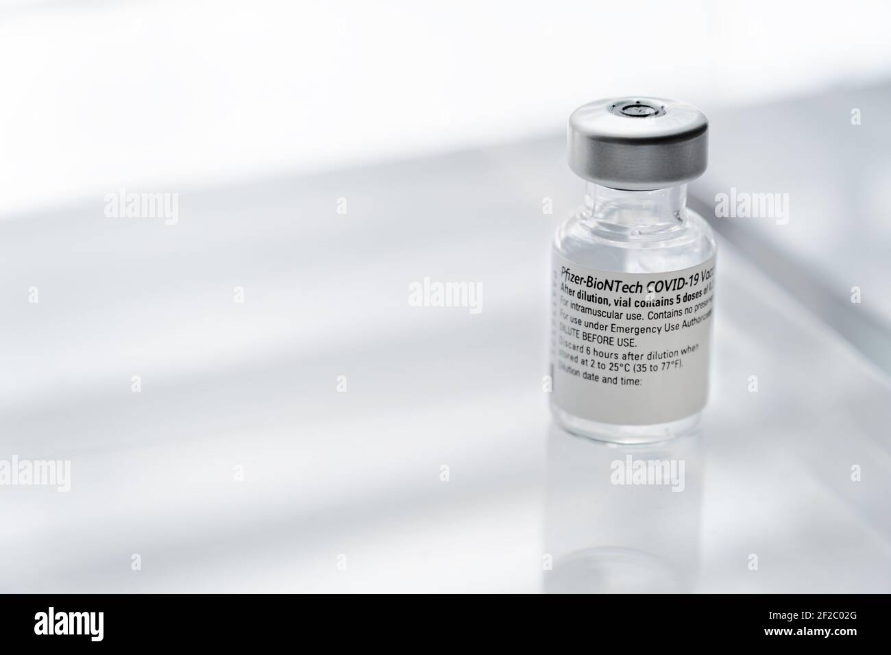 Montreal, CA - 2 March 2021: Vial of Pfizer BioNTech Covid-19 vaccine Stock Photo
