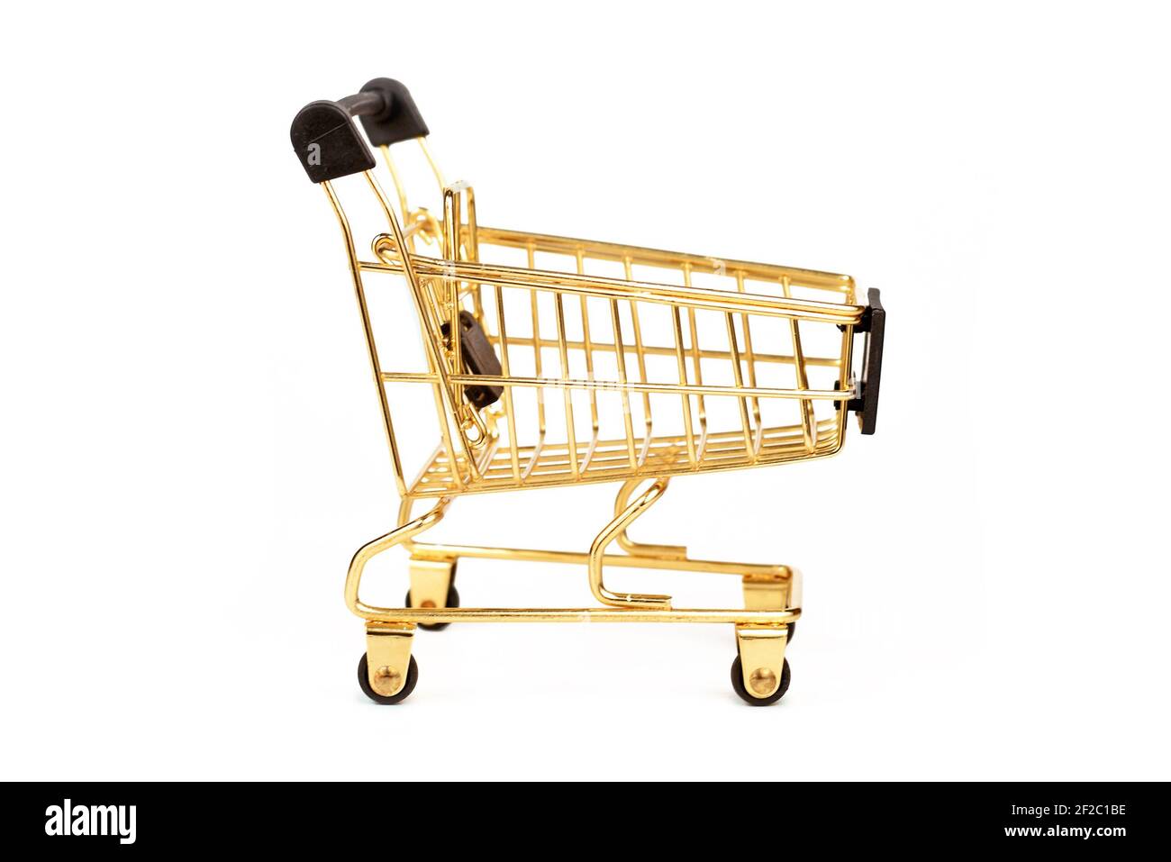 Empty golden shopping cart isolated on white background Stock Photo