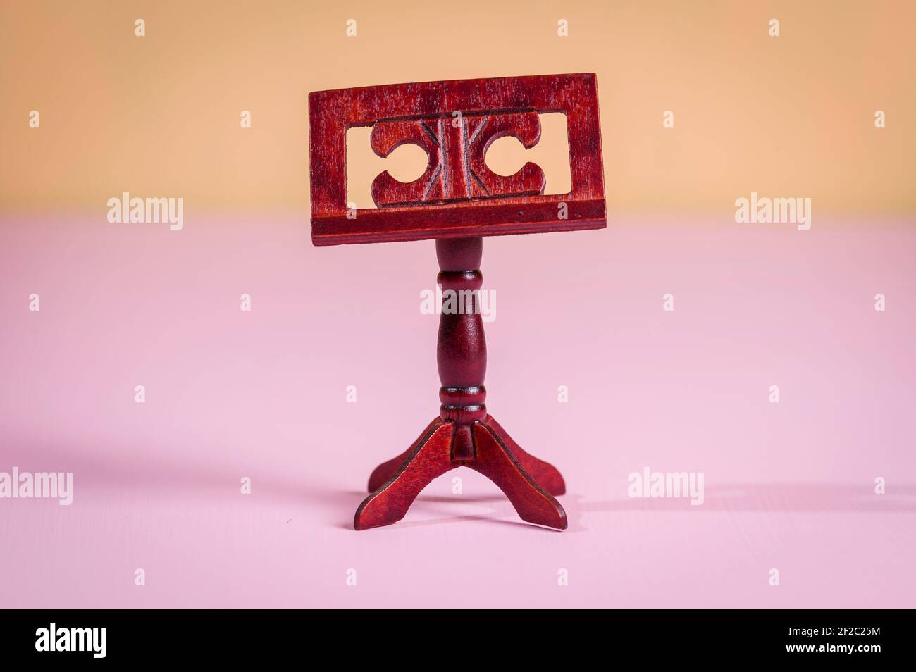 A miniature violin for a dollhouse Stock Photo