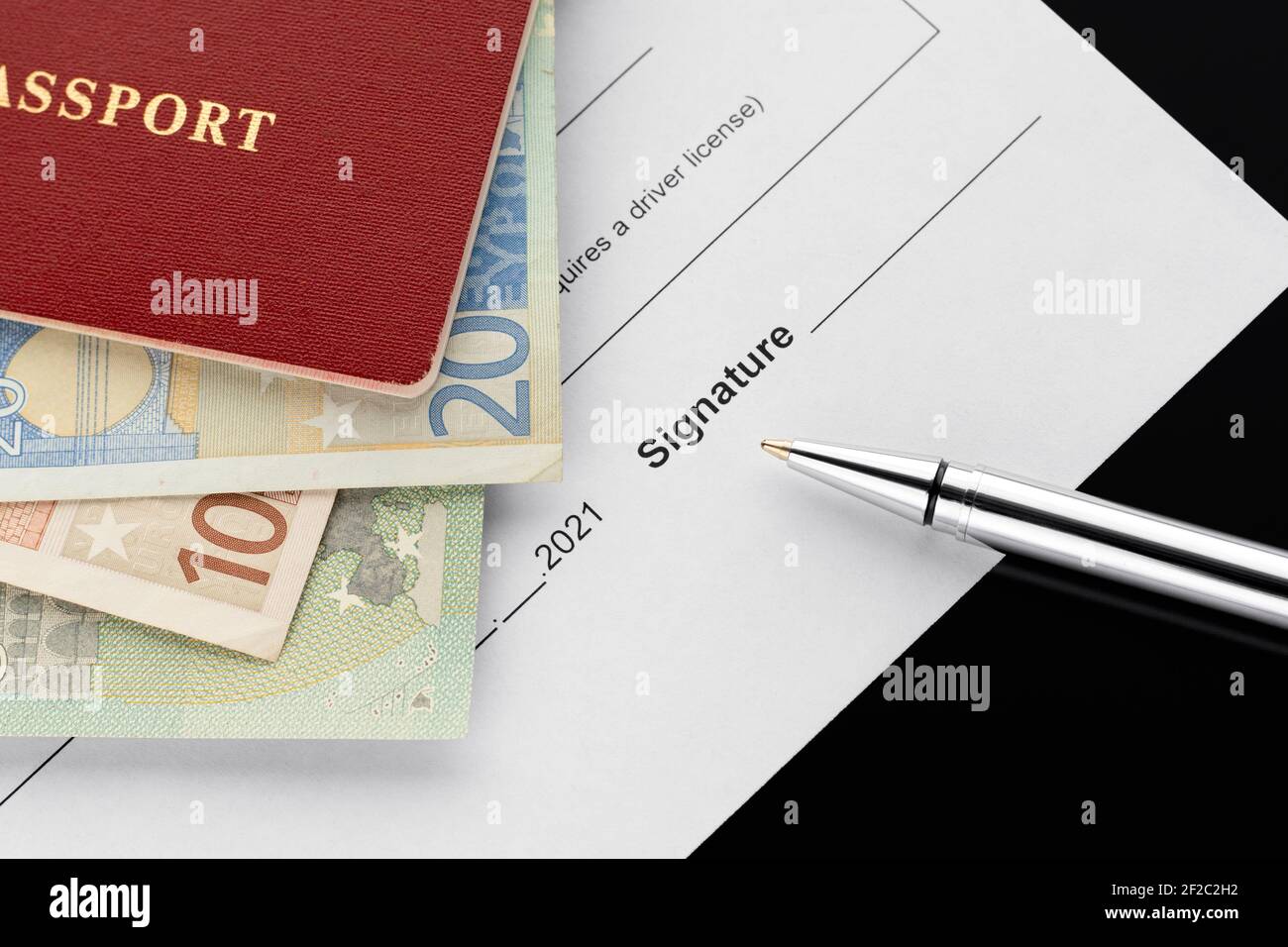 Passport with euro banknotes, document signing. 2021 year. Car rental