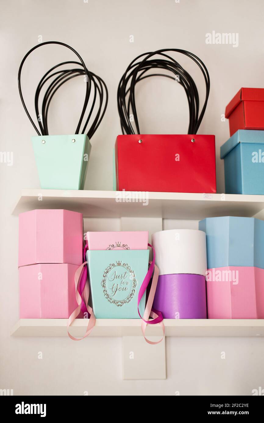 Decorative boxes for packing flowers on a shelf in a flower shop Stock