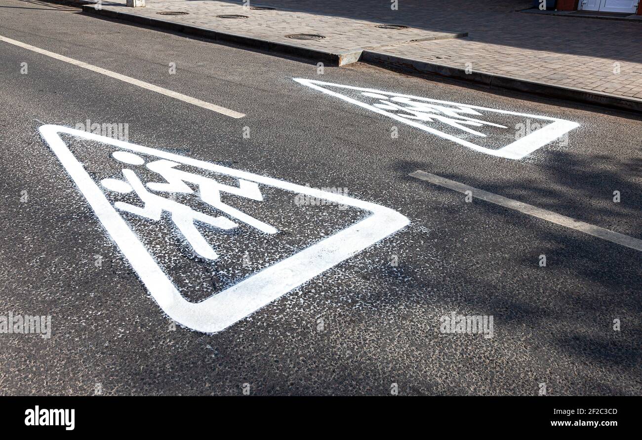Children crossing street the road sign. Traffic sign on asphalt road ...