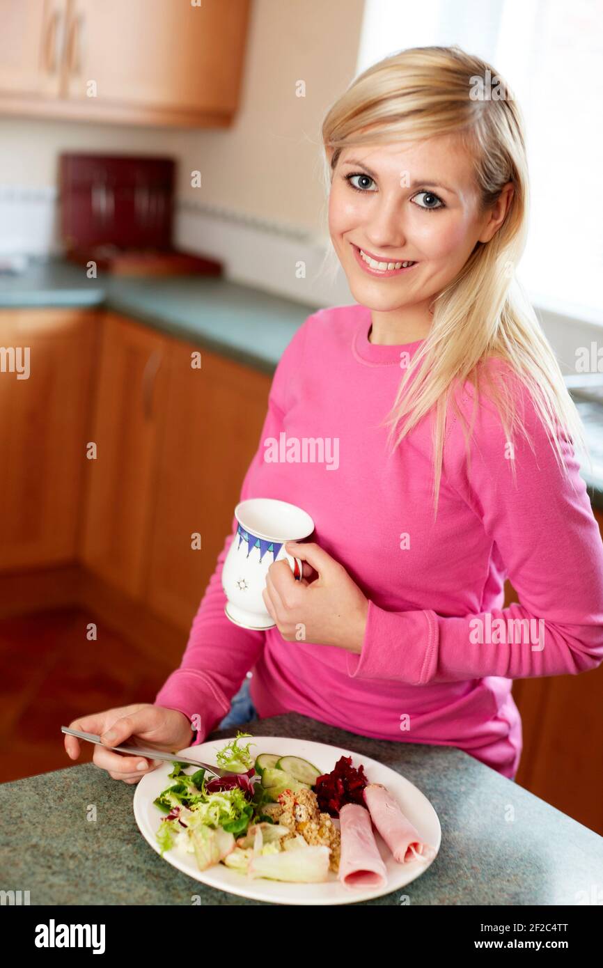 Woman eating salad Stock Photo