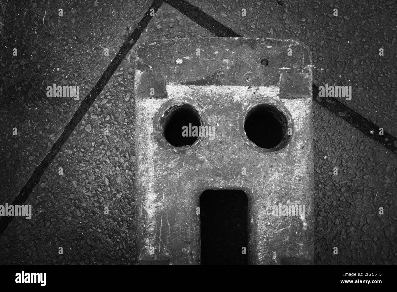 Concrete block looking like scared, surprised face Stock Photo