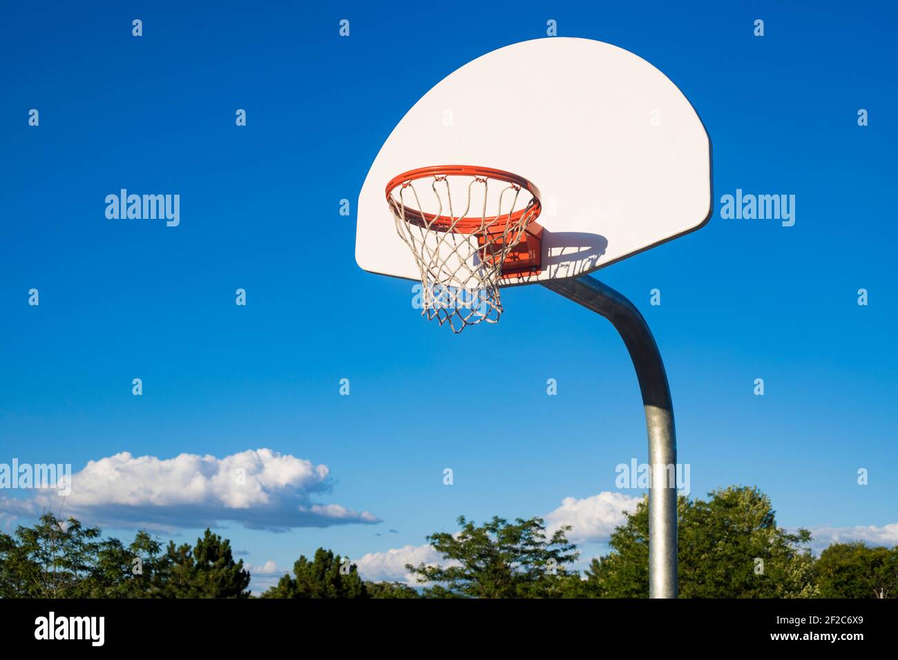 Basketball hoop on blue sky background in th school yard Stock Photo