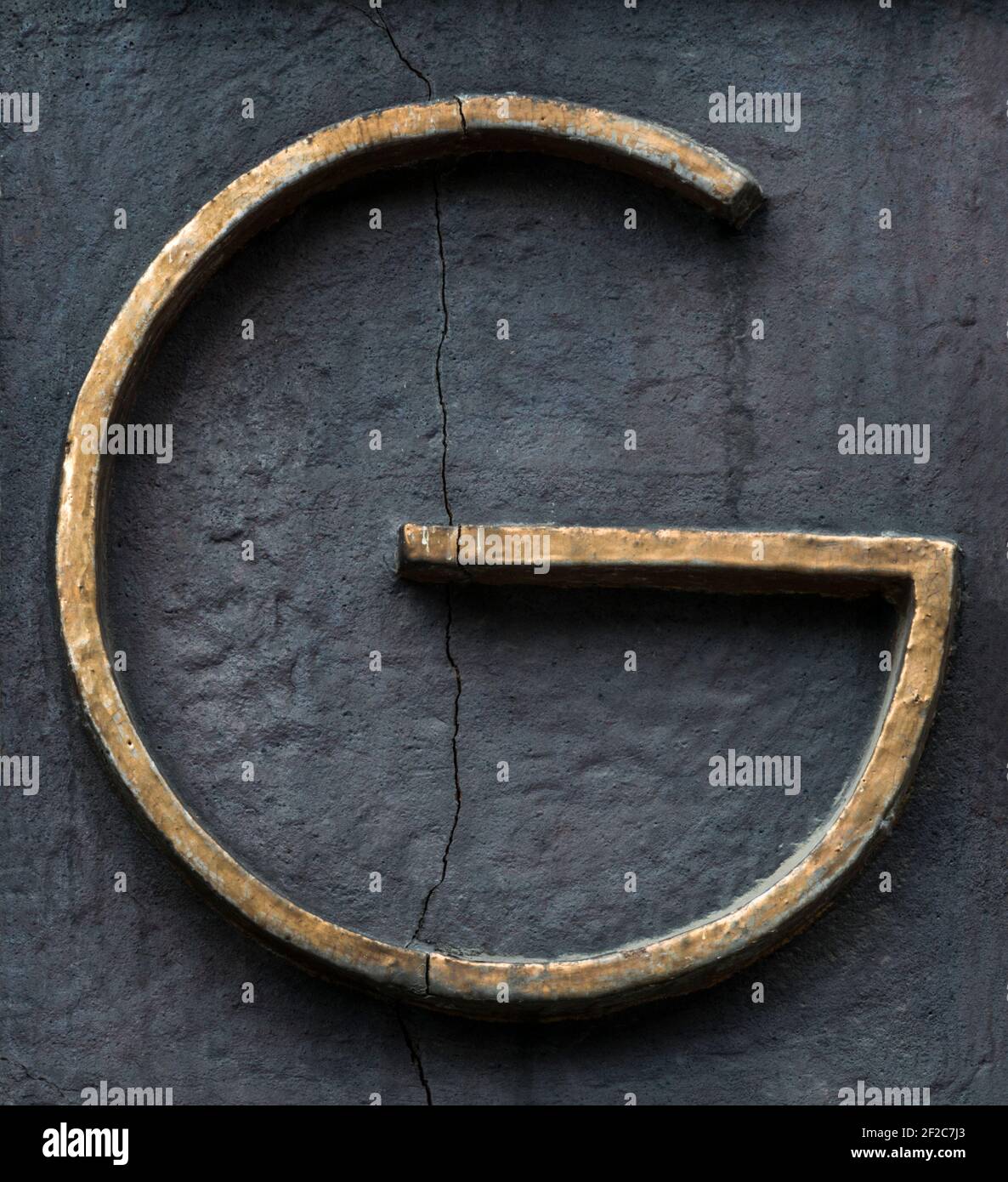 Thin gold letter G from the 1920s Stock Photo