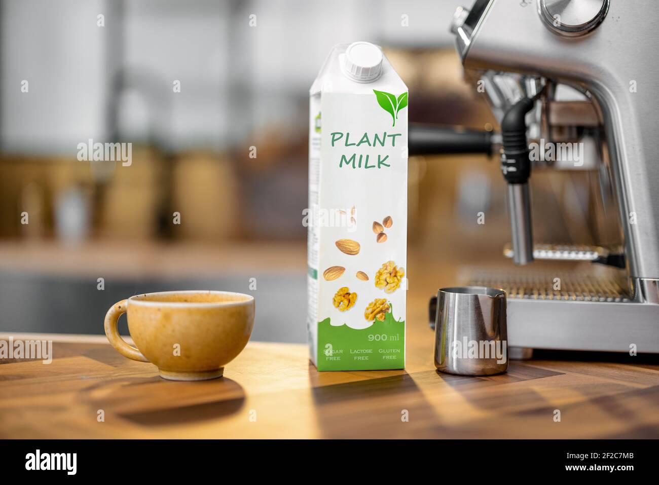 Packaging Of Vegetable Milk Near A Cup Of Coffee Pincher And Coffee Machine On Wooden Table Top On The Kitchen Organic Nut Dairy Alternative Drink Copy Space Stock Photo Alamy