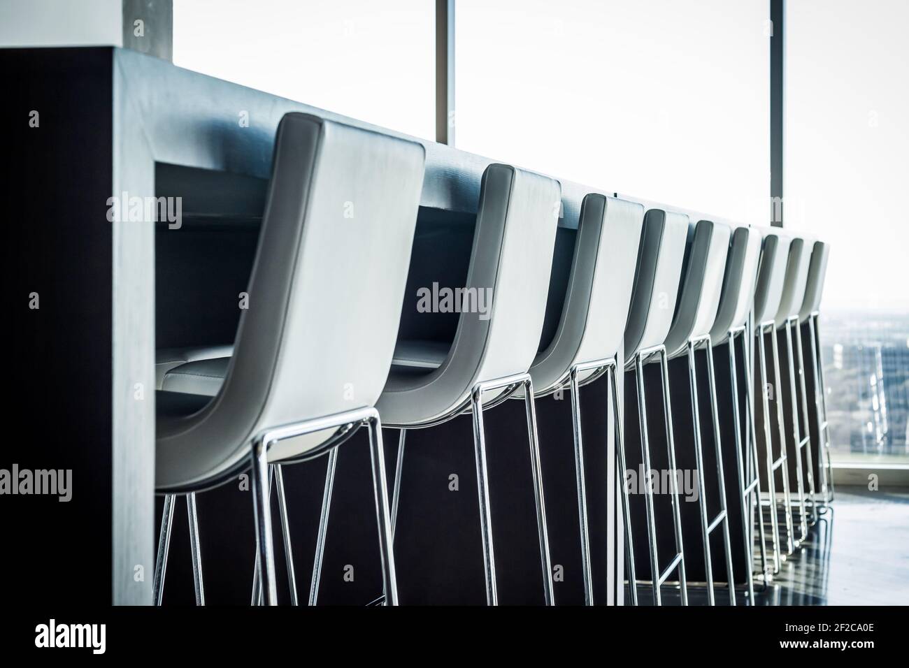 Empty modern chairs in a row in an office building Stock Photo