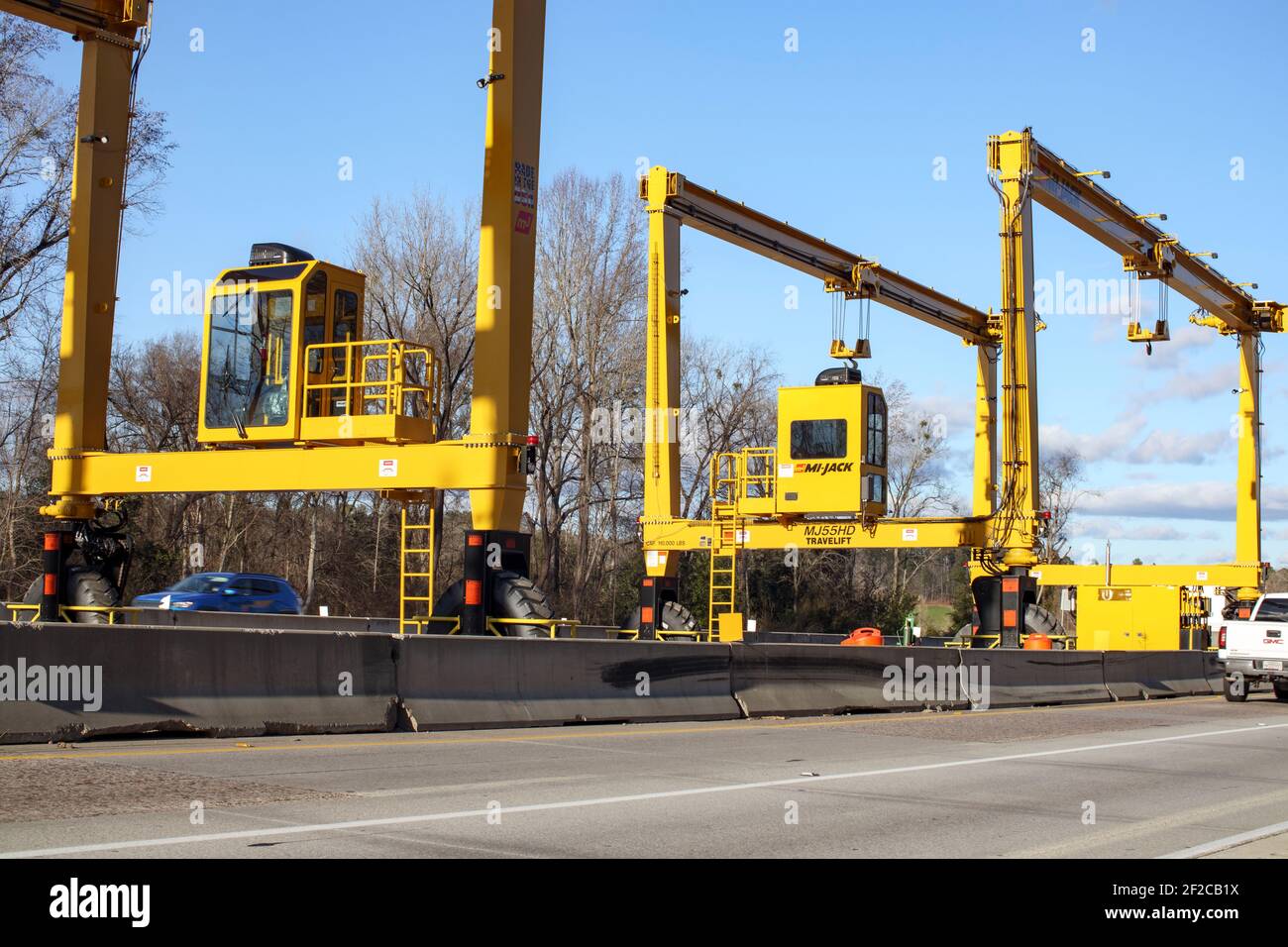 Augusta, Ga USA 02 07 21 Huge Heavy industrial road machines and cranes on a bridge