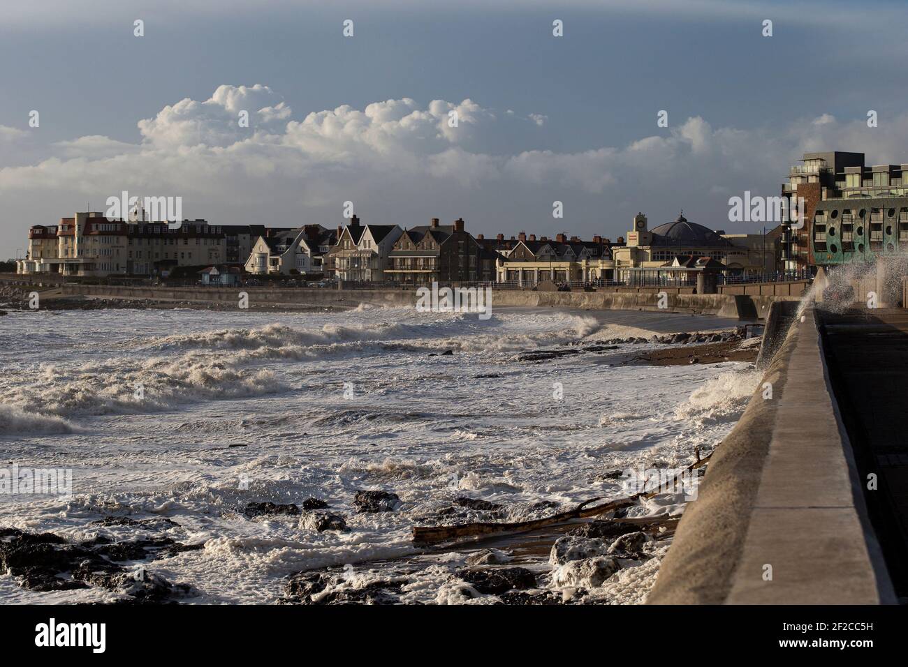 A view of Porthcawl Town Beach during high tide and strong winds of 67mph hit the South Wales Coast on the 11th March 2021. Credit: Lewis Mitchell Stock Photo