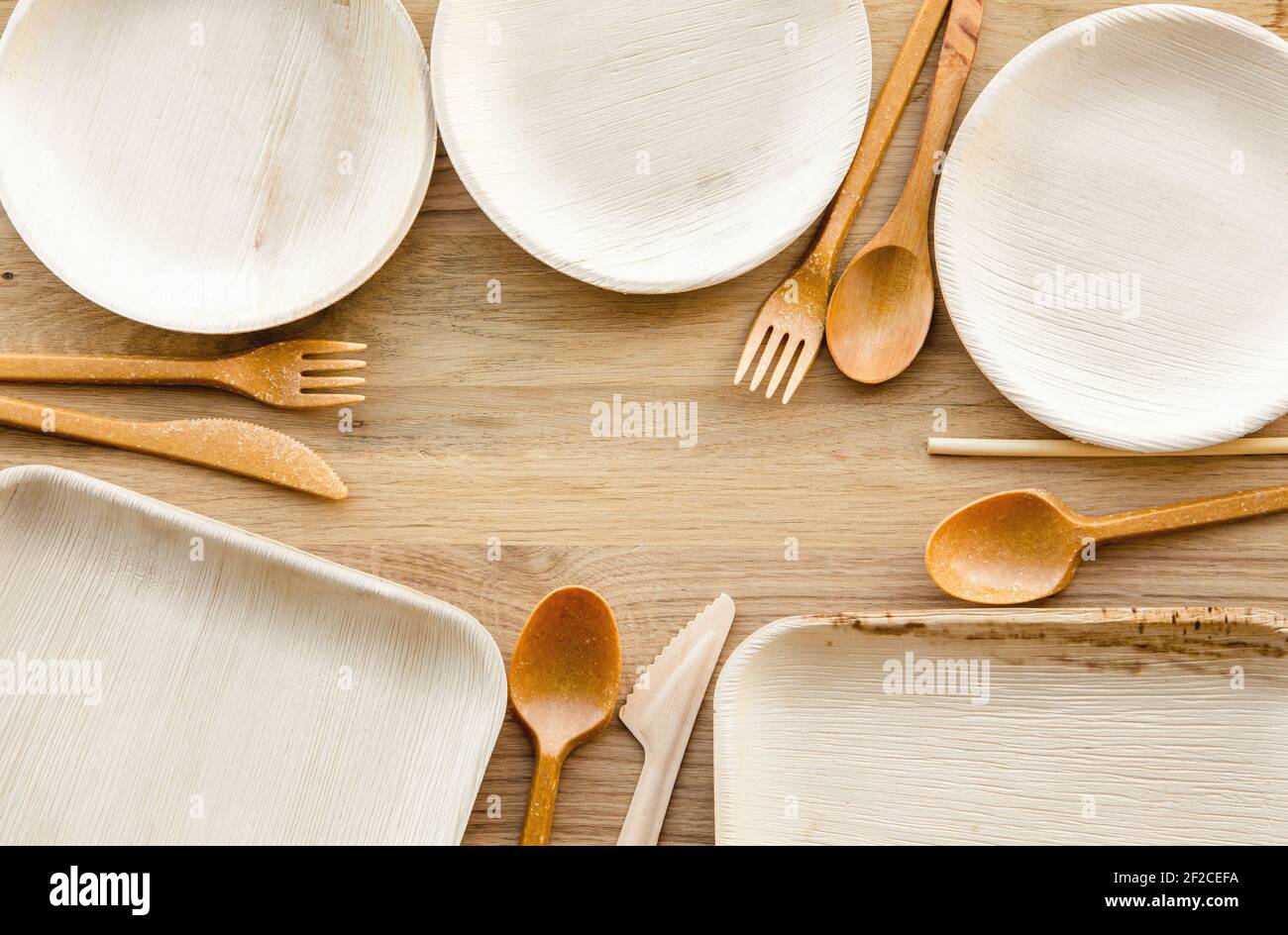 Set of dry biodegradable empty new palm leaf plates and edible fork