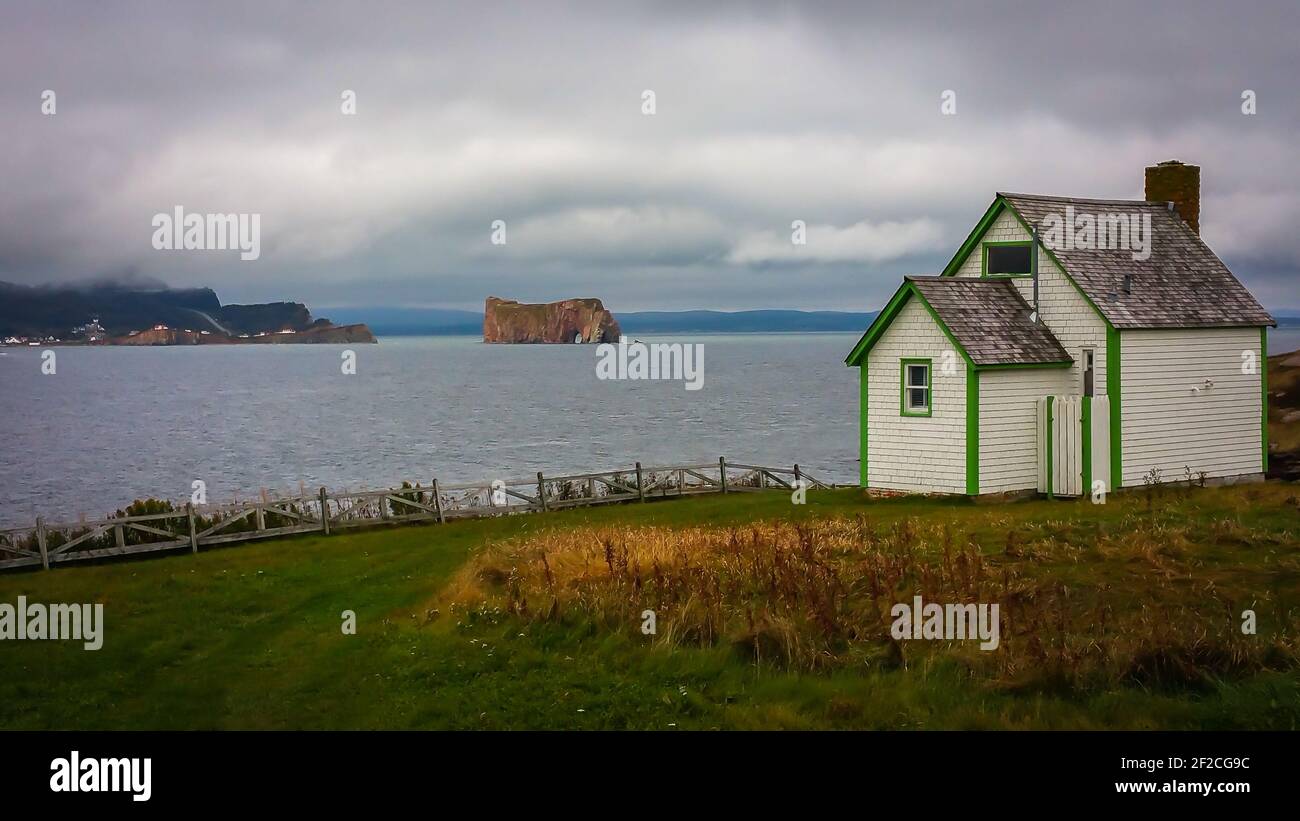 Quebec province, Canada, Sept 2019, wooden house by the Gulf of Saint Lawrence and Percé Rock Stock Photo