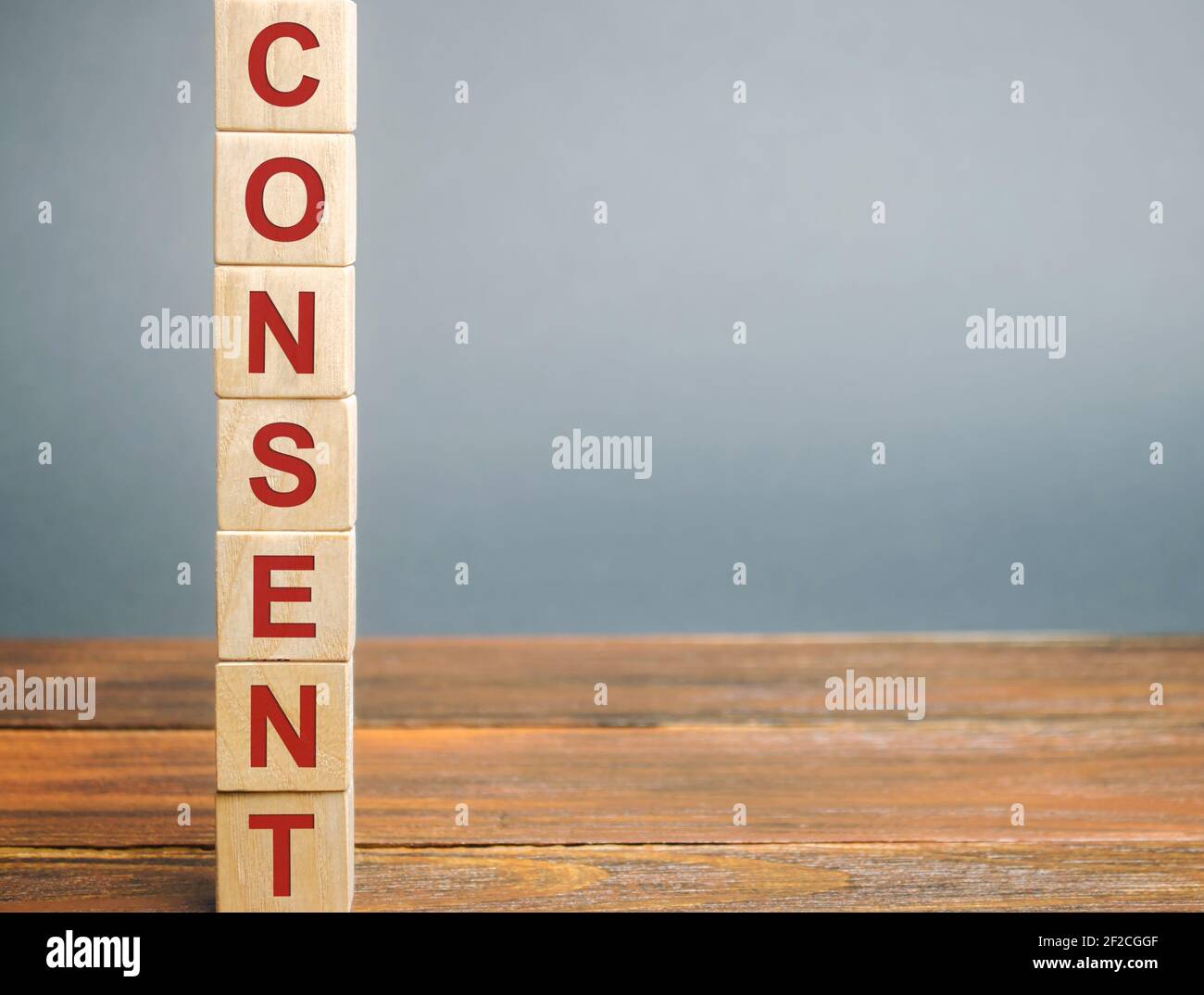 Wooden blocks with the word Consent. Acceptance, agreement and comprehension concept. Business contract and deal. Convention Stock Photo