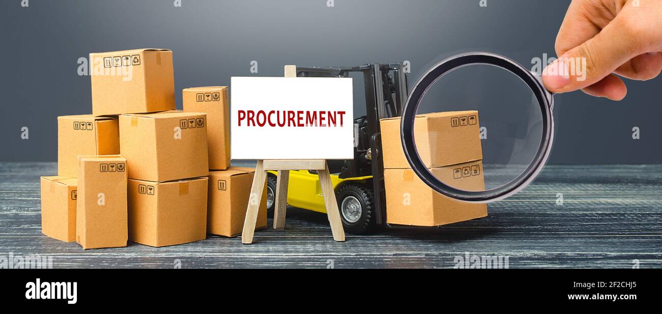 Yellow Forklift truck with cardboard boxes and stand with the word