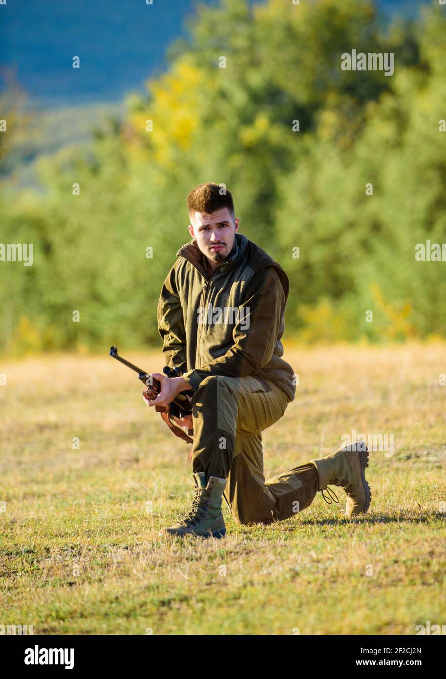 Hunting shooting trophy. Hunter with rifle looking for animal. Hunting as  male hobby and leisure. Man charging hunting rifle. Hunter khaki clothes  Stock Photo - Alamy
