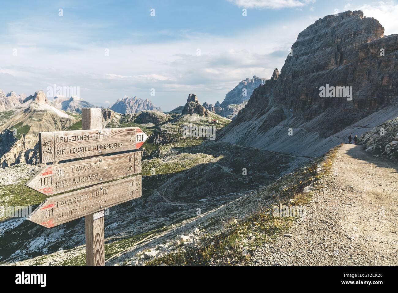Signpost in the Dolomites points the way a mountain hut Stock Photo