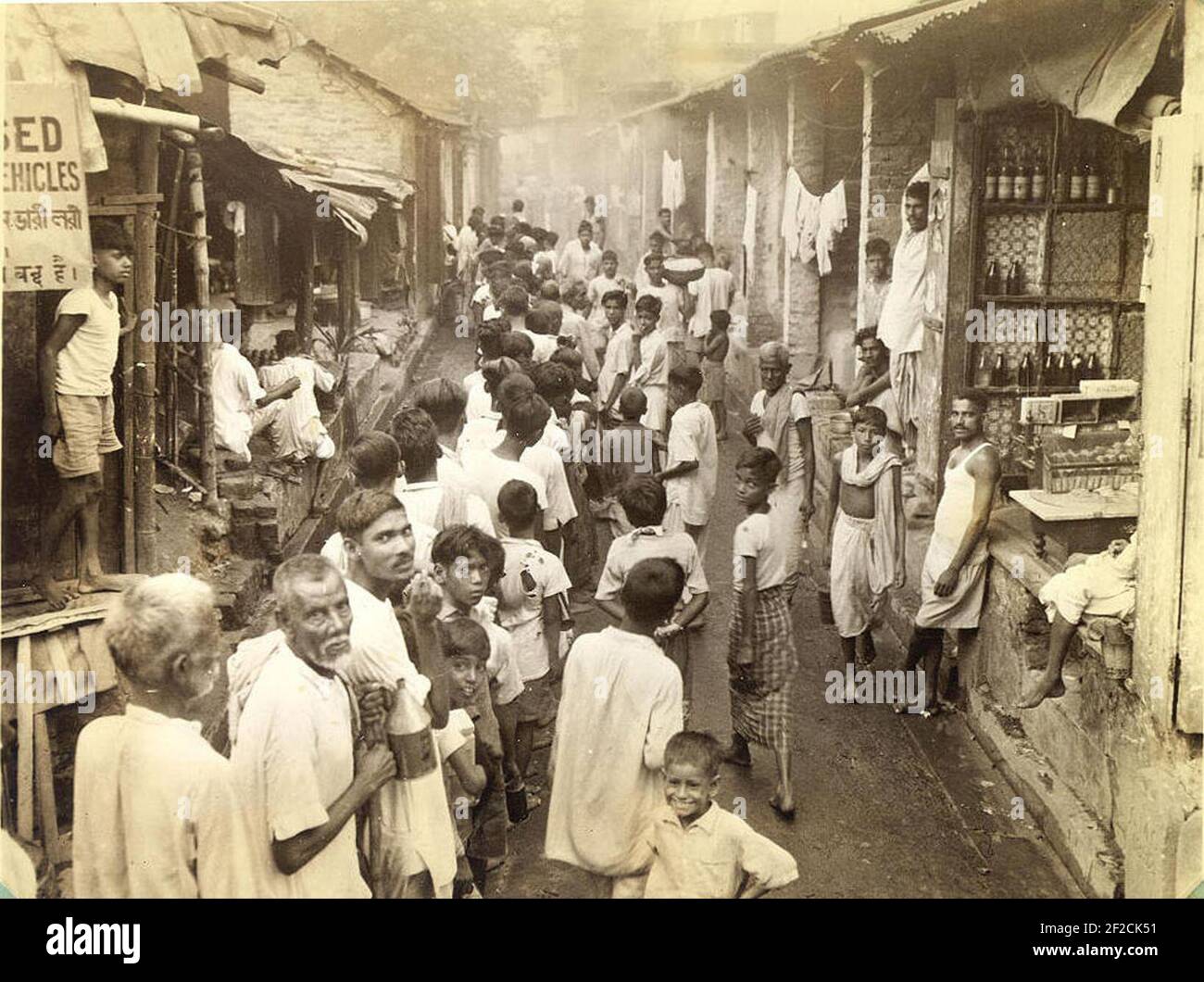 Poor people in Calcutta form a line to buy kerosene in 1945 Stock Photo ...
