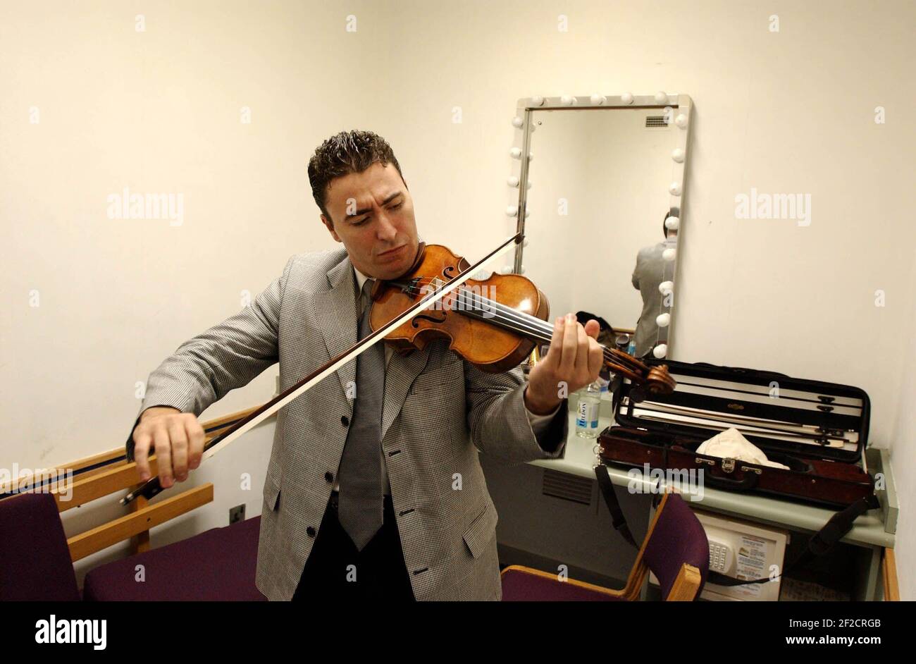 Violinist Maxim Vengerov tuning up before the award ceremony of the