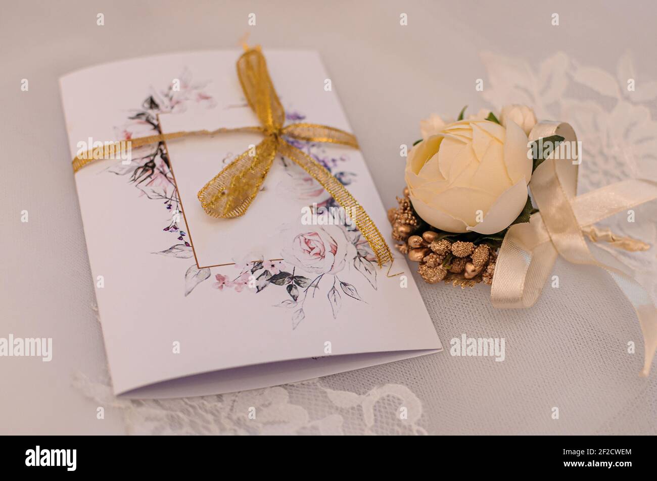 Groom boutonniere on white background Stock Photo