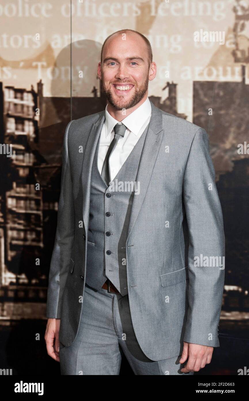 Joe Sims arrives at the Crime Thriller Awards 2014 at the Grosvenor House Hotel - London Stock Photo