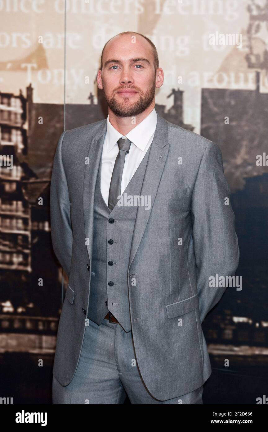Joe Sims arrives at the Crime Thriller Awards 2014 at the Grosvenor House Hotel - London Stock Photo