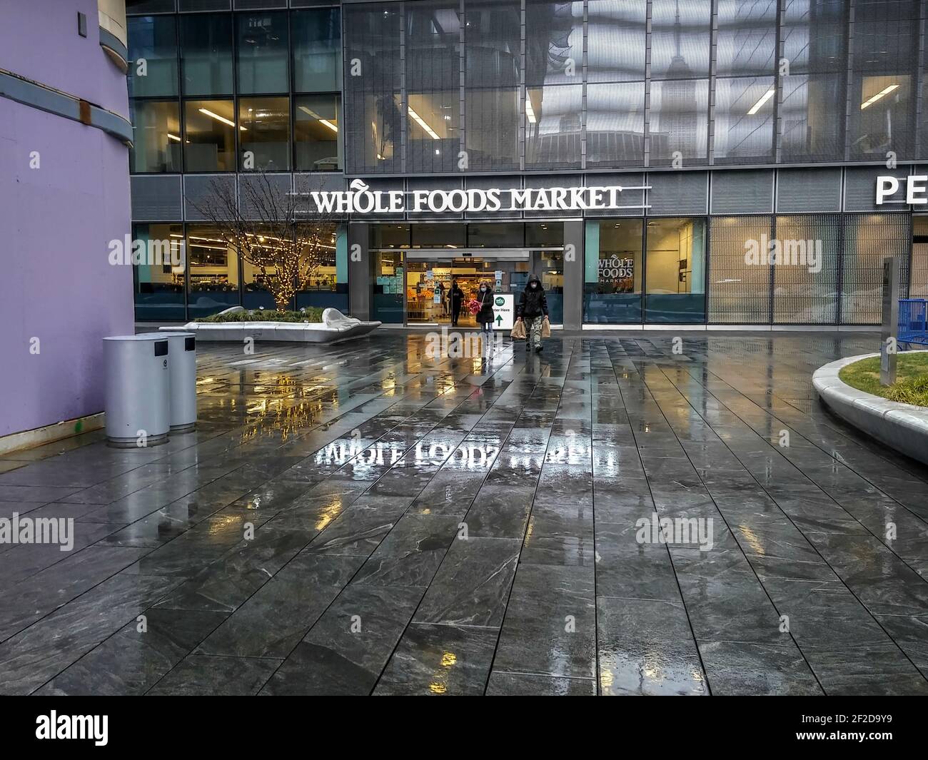 https://c8.alamy.com/comp/2F2D9Y9/customers-exit-and-enter-the-whole-foods-manhattan-west-in-the-hudson-yards-neighborhood-of-new-york-on-sunday-february-28-2021-richard-b-levine-2F2D9Y9.jpg
