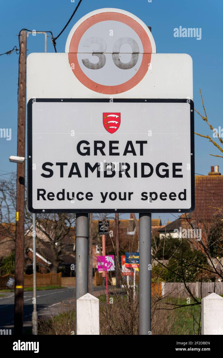 Village sign in Great Stambridge village, Essex, UK, with estate agency signs beyond. Rural property market Stock Photo
