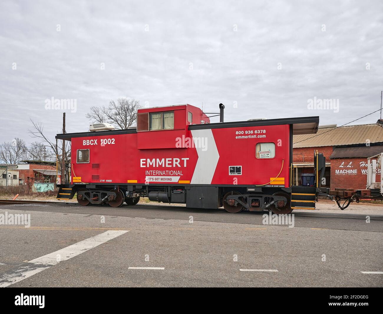Emmert traditional red caboose at the end of a railroad train in Montgomery Alabama, USA. Stock Photo