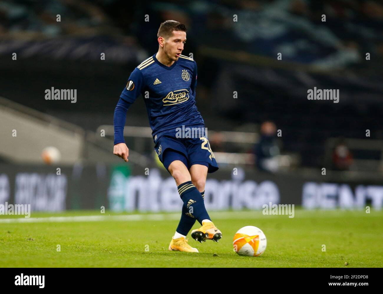 BUDAPEST, HUNGARY - AUGUST 13: (l-r) Tokmac Chol Nguen of Ferencvarosi TC  wins the ball from Arijan Ademi of GNK Dinamo Zagreb during the UEFA  Champions League Third Qualifying Round match between