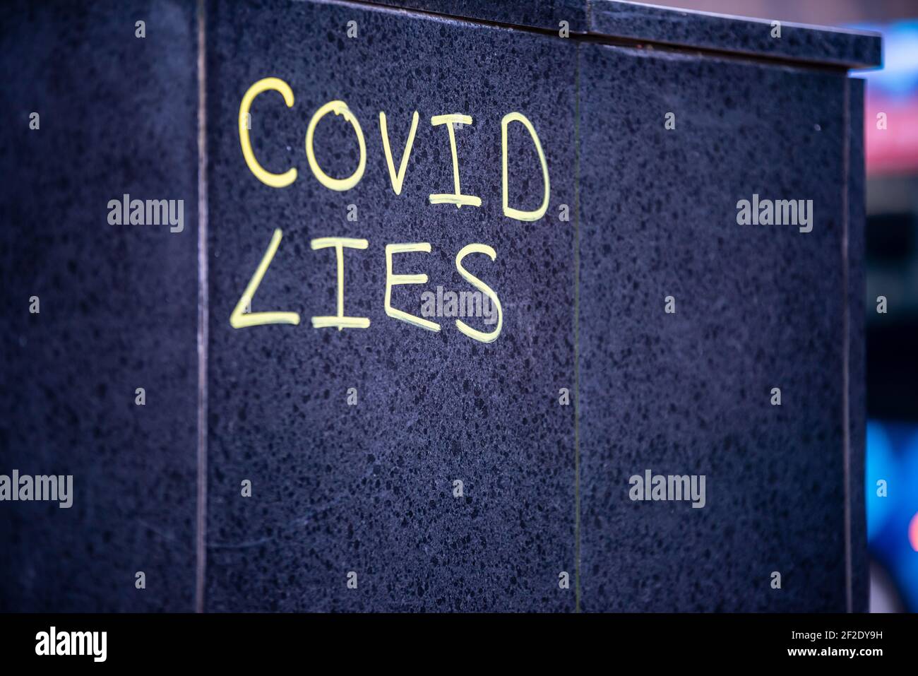 Covid Lies graffiti scrawled on a city wall, Birmingham, UK Stock Photo
