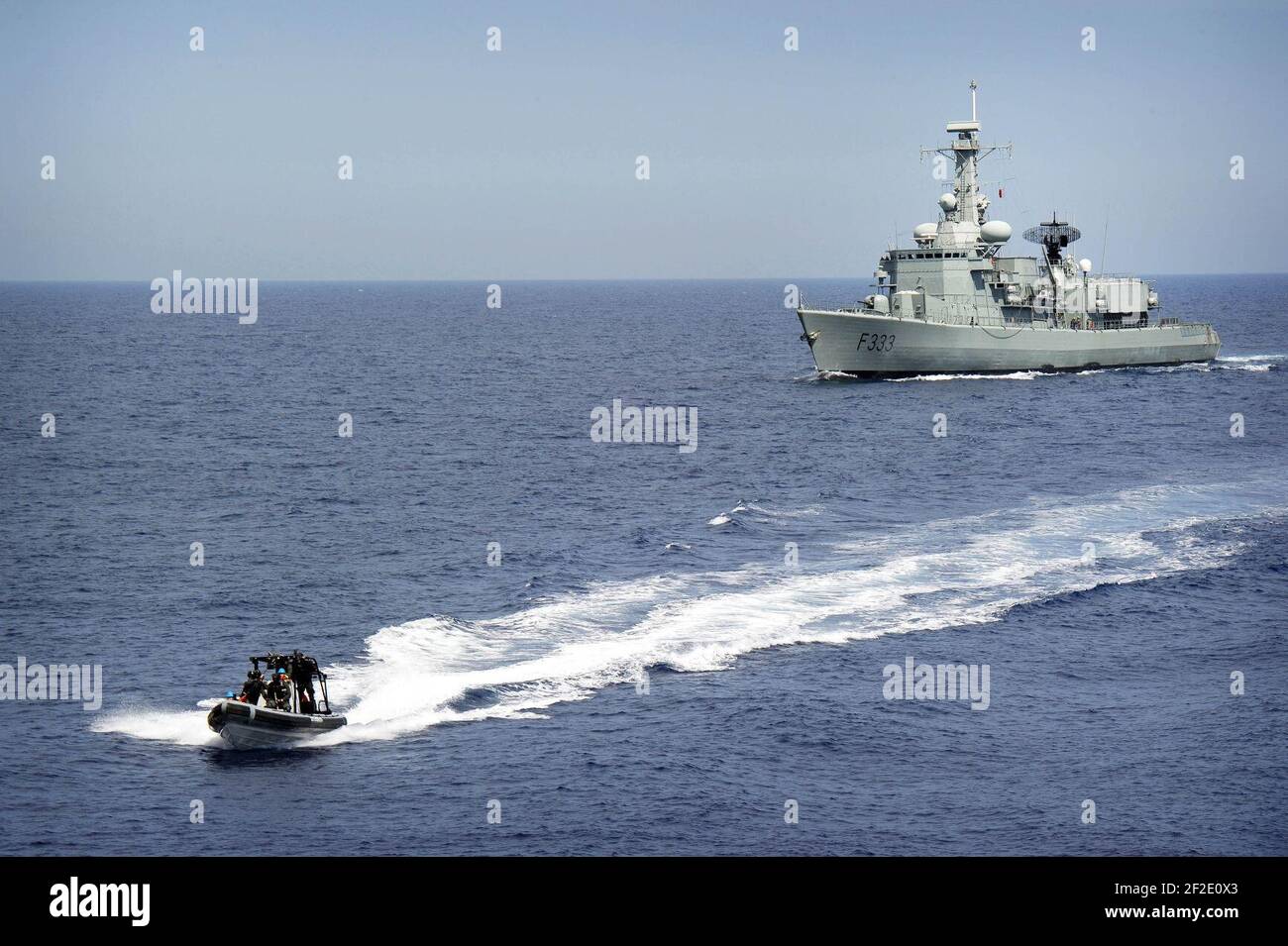 Portuguese navy VBSS team in a rigid-hull inflatable boat leaves the NRP Bartolomeu Dias. Stock Photo